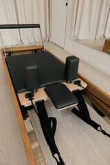 Pilates reformer training machine with natural wood elements top view