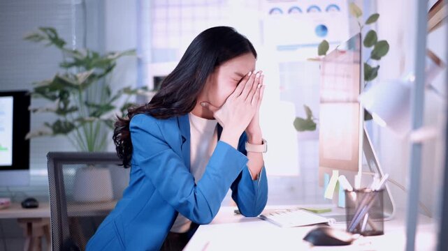 Asian businesswoman feeling sick at work