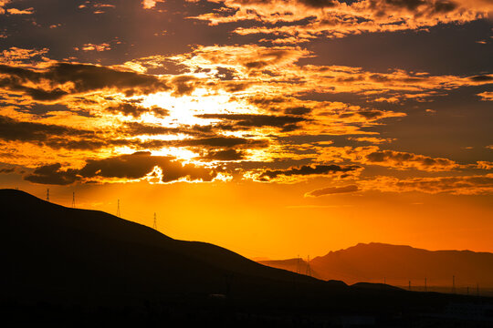 sunset over the mountains road