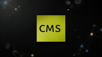 Content Management System acronym CMS written on a sticky note against a dark background