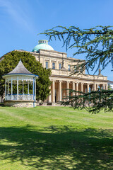 Obraz premium The restored Regency bandstand next to the Pittville Pump Rooms, Cheltenham Spa, Gloucestershire, England UK