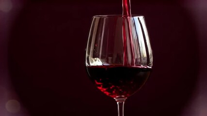 Elegant stream of rich red wine being poured into a crystal glass - Powered by Adobe
