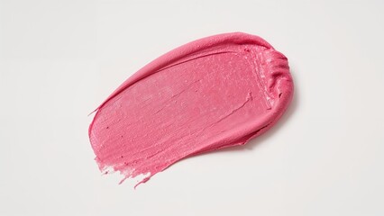 Fototapeta premium Close-up of a pink clay mask spread on a plain white surface