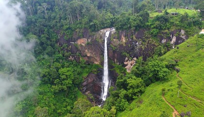 Lush waterfall cascading down rocky face