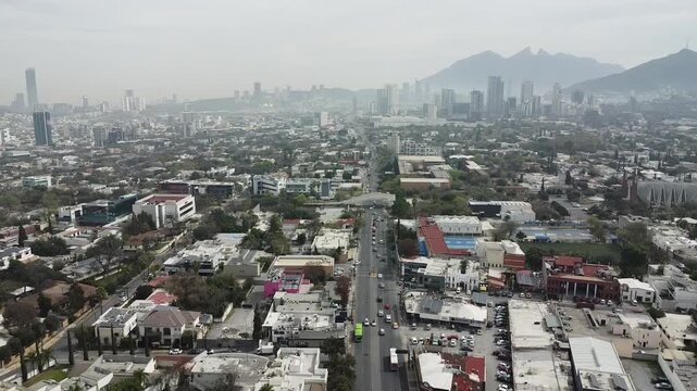 avenue in the city of monterrey nuevo leon, with the cerro de la silla mountain in the background