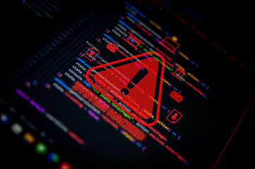 Cybersecurity breach warning with red alert symbol and “System Hacked” text over programming code, representing hacking, malware, and data security threats in digital networks.
