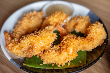 Fried shrimp served on plate with vegetable