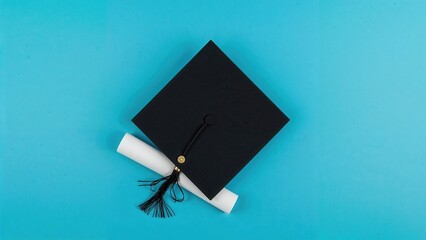 Blue background featuring a graduation hat and diploma seen from above, text area available