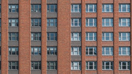 Obraz premium Office buildings made of brick represent robustness, steadiness, and business professionalism, with window-lined facades reflecting productivity and clear communication, embodying the core of city