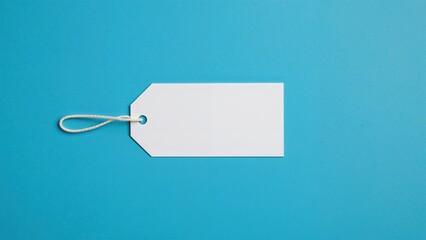 Naklejka premium Tags indicating different garment sizes. Viewed from above. Flat layout. Sizes small and medium visible. Text area included. Blue background. Plain craft paper square label. Mockup template.