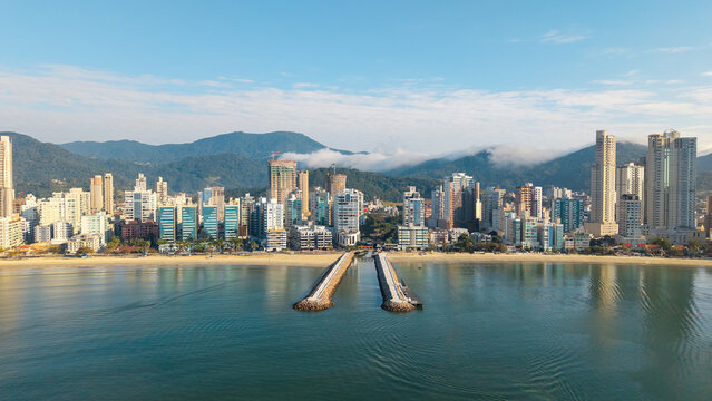 Fototapeta Aerial view of Itapema beachfront with pier and modern skyline, Santa Catarina, Brazil.