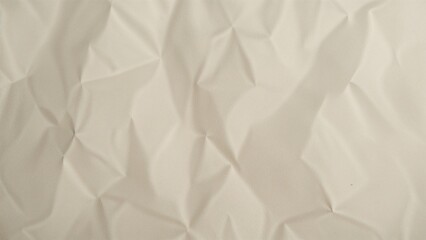 Fototapeta premium Macro image of a wrinkled, glossy recycled paper surface with an artistic white illumination.