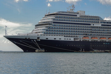 Modern luxury cruiseship cruise ship liner Koningsdam, Nieuw Statendam or Rotterdam in port of Oranjestad, Aruba ABC Islands tropical paradise during Caribbean dream vacation cruising