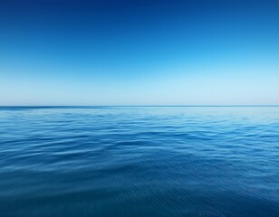 Obraz premium minimalist background of perfect smooth water surface under clear blue sky creating calm and peaceful atmosphere with gentle ripples on ocean