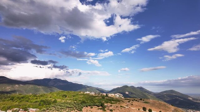 Aerial time lapse over Agro Pontino with wider vistas of Sermoneta the Circeo the Pontine Islands Ponza Ventotene  Palmarola and the city of Latina with farmland sky and clouds in motion