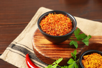 Different aromatic spices on wooden table, closeup