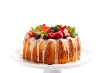 Delicious bundt cake with berries, glaze and mint isolated on white