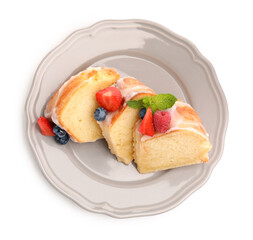 Pieces of delicious bundt cake with berries, glaze and mint isolated on white, top view