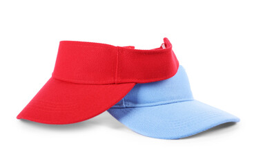 Red and light blue visor caps isolated on white. Mockup for design