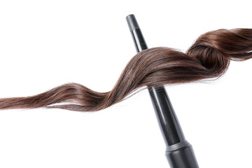 Naklejka premium Curling iron with brown hair lock isolated on white