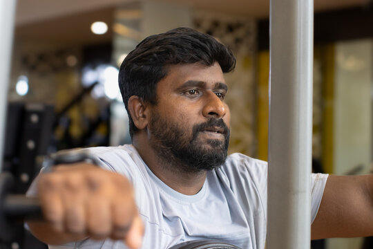 Portrait of Handsome man gym workout to reduce body weight to maintain the fitness in the fitness center