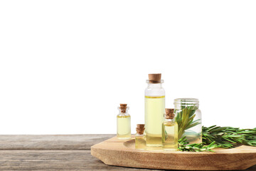 Bottles of essential oils and rosemary on wooden table against background