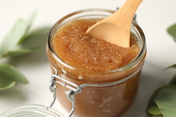 Natural body scrub on white table, closeup