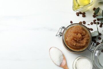 Natural body scrub and ingredients on white table, flat lay. Space for text