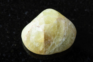 sample of polished saamite mineral on black