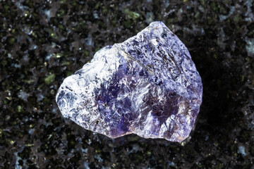 sample of unpolished cordierite mineral on black