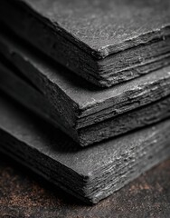 Close-up of layered dark grey slate tiles (1)