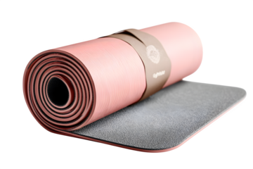 Unrolled pink yoga mat with textured grip and securing strap ready for your next mindful session
