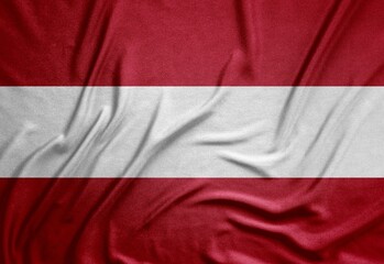 red and white flag of the Republic of Austria on a rough canvas with folds and shadows