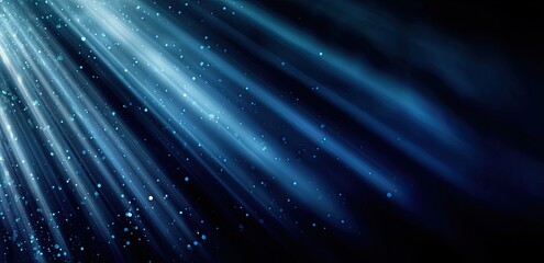 Light rays radiating from a source, with a dark background and subtle particles