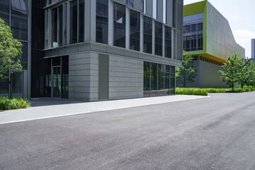 enpty asphalt road with modern office building