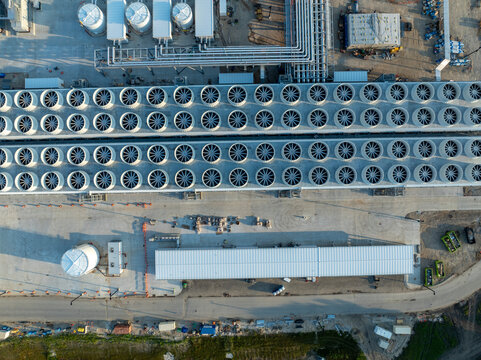 Chilling towers at an AI data center. A bank of cooling towers and infrastructure making sure a data center stays cool - Powered by Adobe