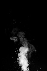 White smoke swirling upwards on dark background. Swirling, writhing smoke to overlay on your photos. Steam explosion special effect. Halloween design