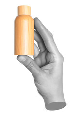 Woman hand holds bamboo cosmetics bottle, isolated on transparent background, natural and eco cosmetics concept. Contemporary art