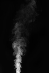 White smoke swirling upwards in dark atmosphere captured in monochrome style. Swirling, writhing smoke to overlay on your photos. Steam explosion special effect. Halloween design.