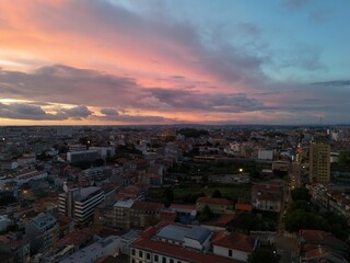 4K Aerial Sunset Drone Footage Over Urban Rooftops, Riverfront from Above with Golden Hour Lighting