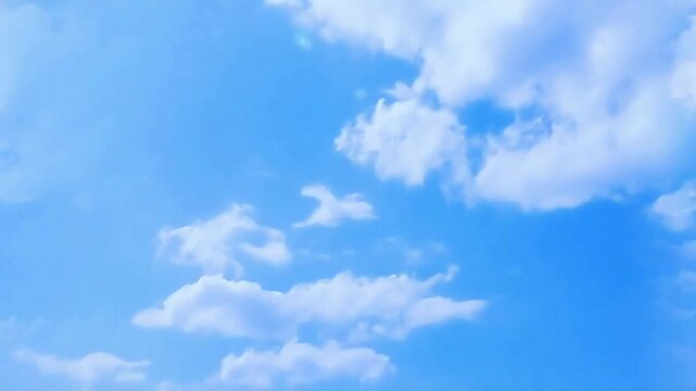 Blue sky filled with fluffy white clouds peaceful atmosphere (Loop)