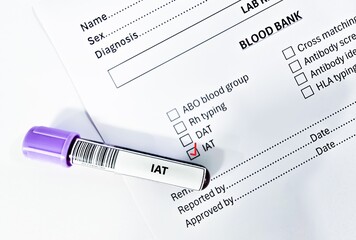 Blood sample tube and paper order request for indirect antiglobulin test analysis.