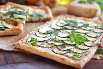 Zucchini puff pastry tart with mozzarella and cream cheese
