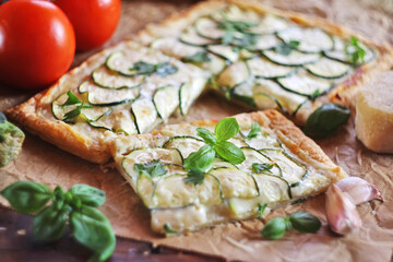 Zucchini puff pastry tart with mozzarella and cream cheese
