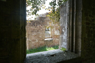 Fototapeta premium All Saints Church, Annesley, Nottingham, England – August 10 2025: View of medieval stone window in summer light at church ruins.