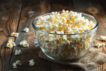 Pop corn on wood color background.Food and snack concepts ideas.Minimal style top view mockup