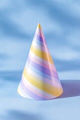 Fototapeta premium Colorful party hat with pastel swirls on blue background.