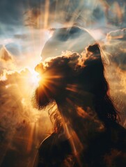 Obraz premium Double exposure of a man with long hair beard and clouds with bright sun rays. Spiritual concept illustration ideal for religion.