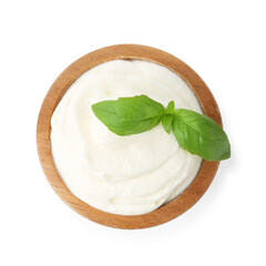 Delicious yogurt with basil in bowl isolated on white, top view