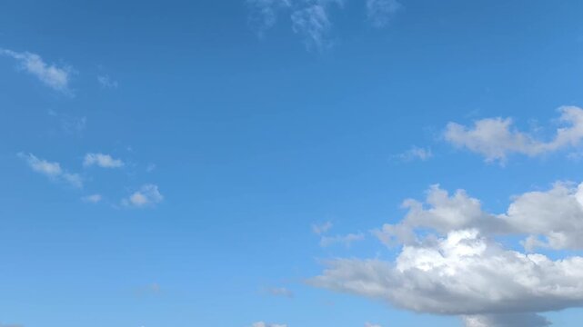 lue sky landscape with several whitish clouds in afternoon
